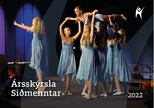 Front page of annual report. Girls in blue dresses and ballerina shoes lift a girl up in the air.